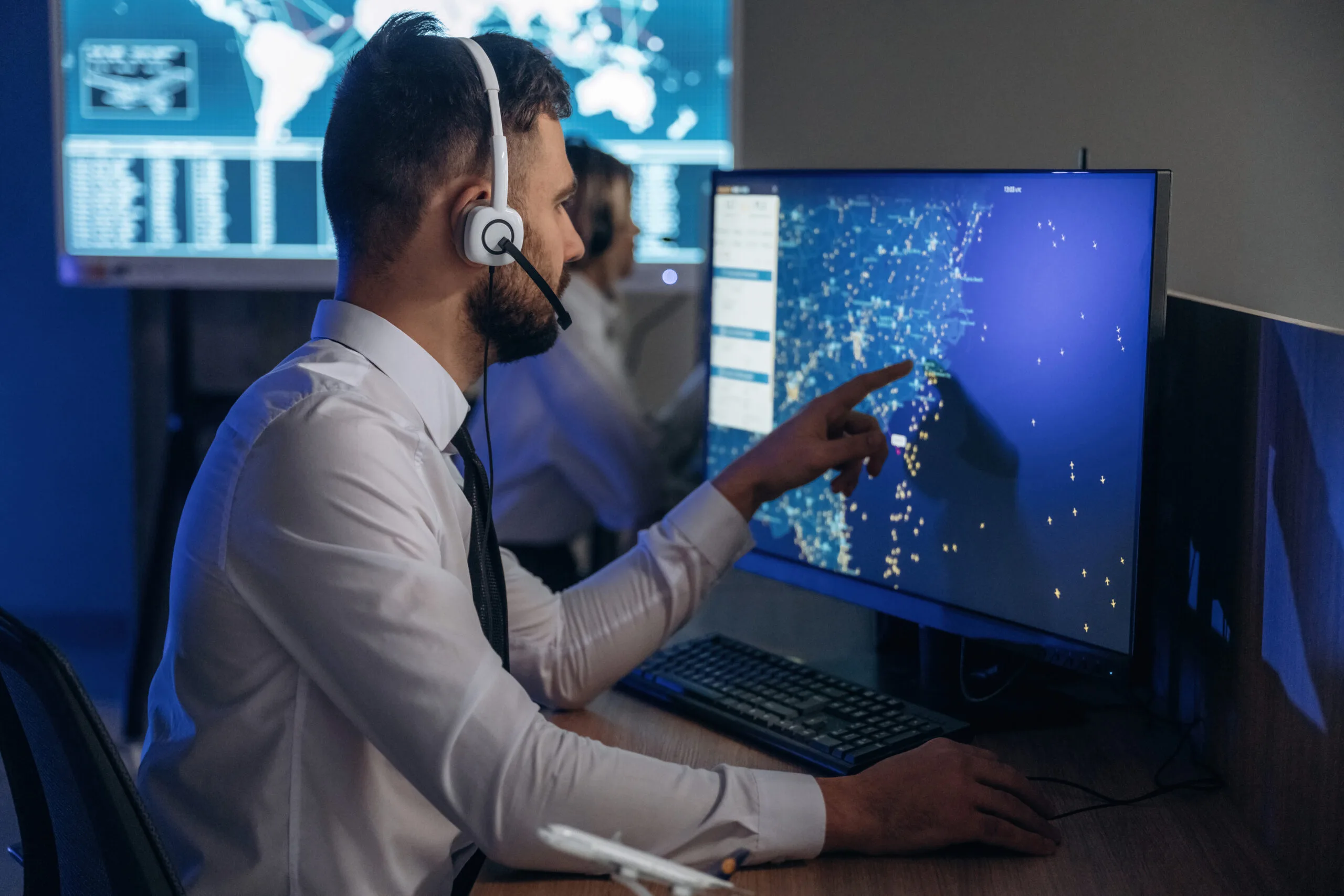 in headphones people are working by computers in 2025 03 18 20 49 31 utc